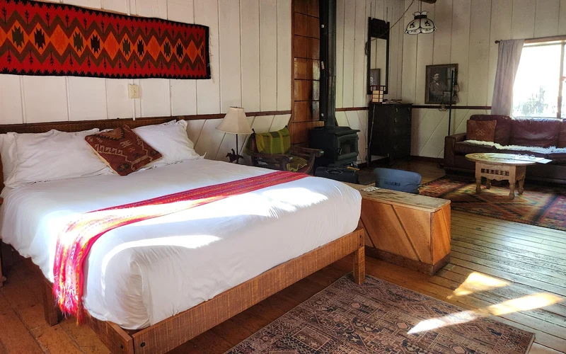 Taos Goji Retreat cabins on the El Prado mesa, fourteen miles from the ski-in ski-out lodging at Taos Ski Valley, New Mexico