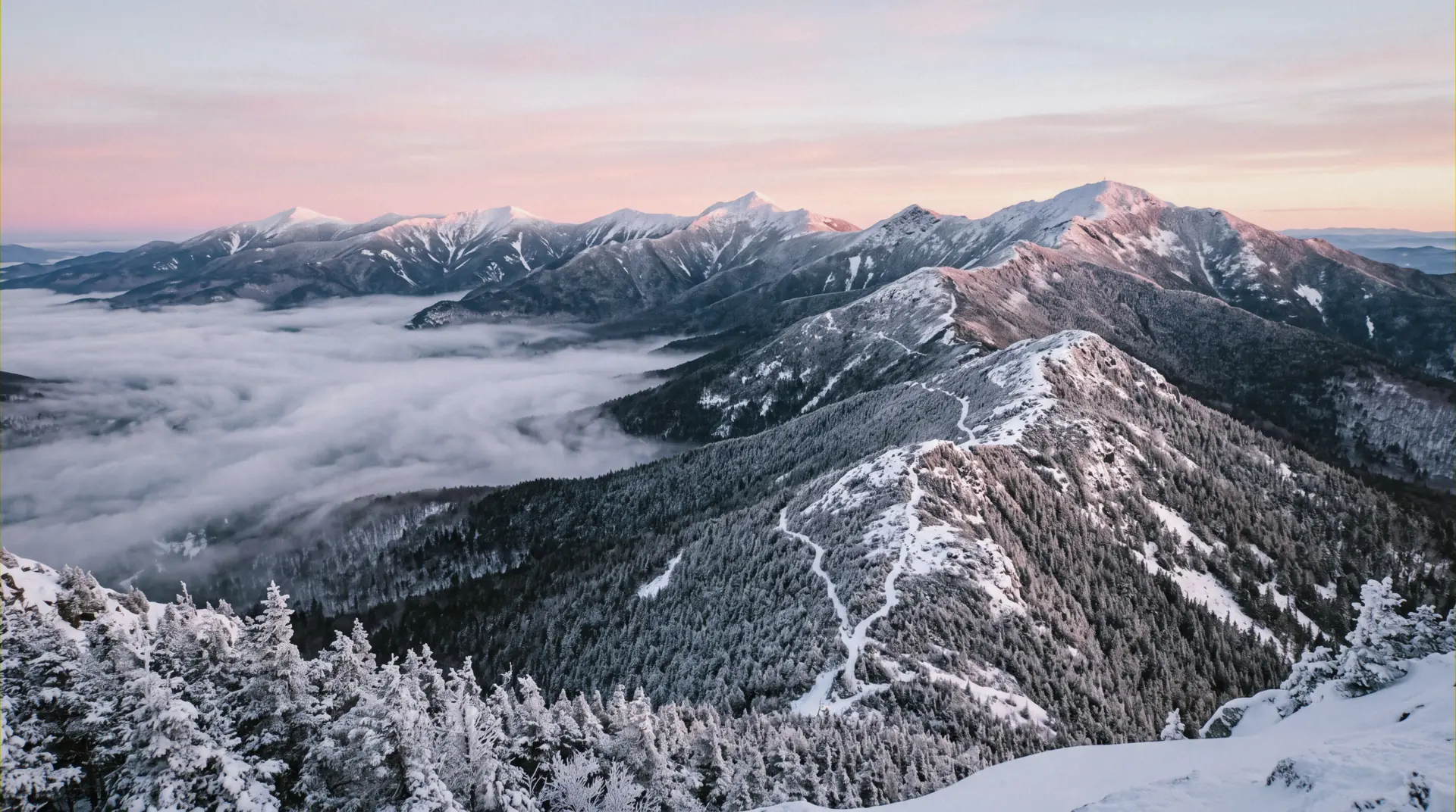 Groomed trails spread across the eight peaks of Sunday River, Maine, above the bases where its ski-in ski-out lodging sits
